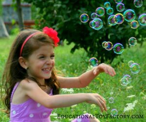 This little girl is loving her bubbles. If you even wondered how to make bubble solution at home, you're in luck.